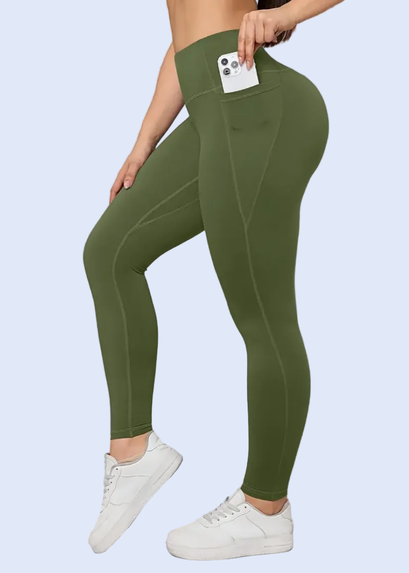 Person wearing green leggings with a white background