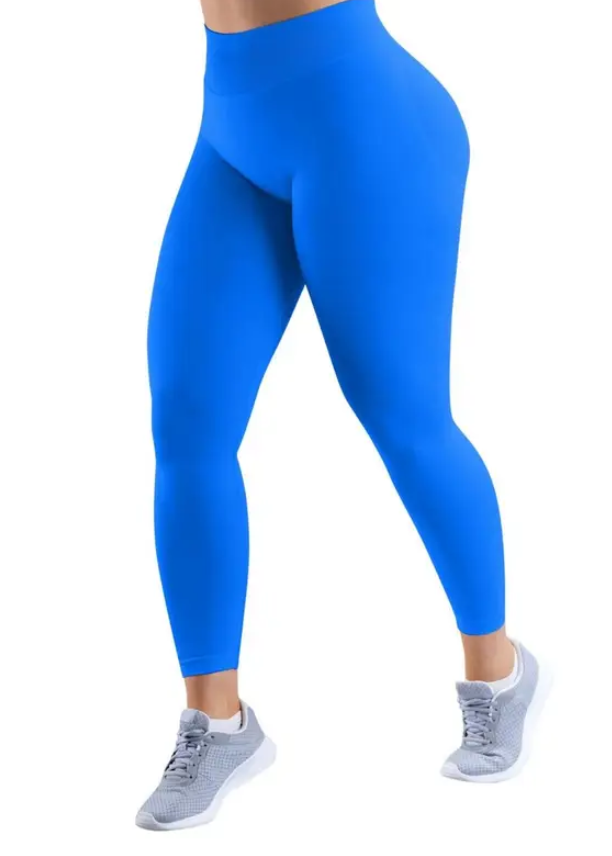 Person wearing bright blue leggings on a white background