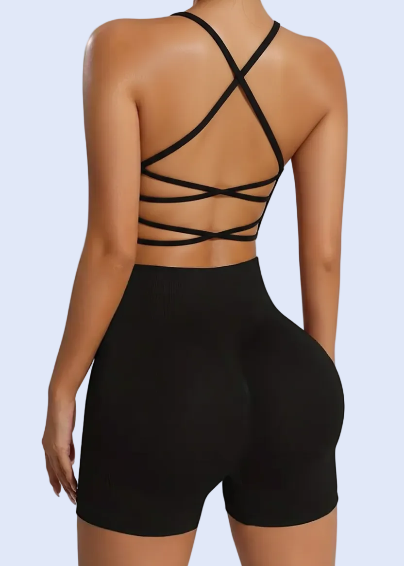 Black strappy top and shorts set on a plain background