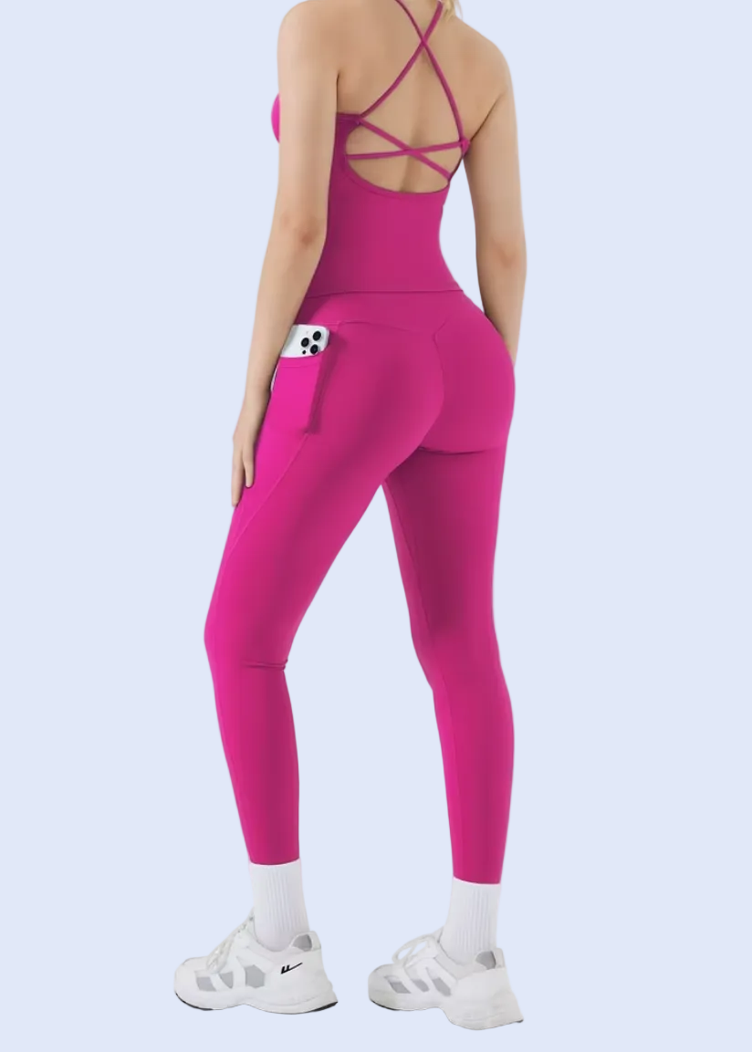 Person wearing a bright pink jumpsuit on a white background