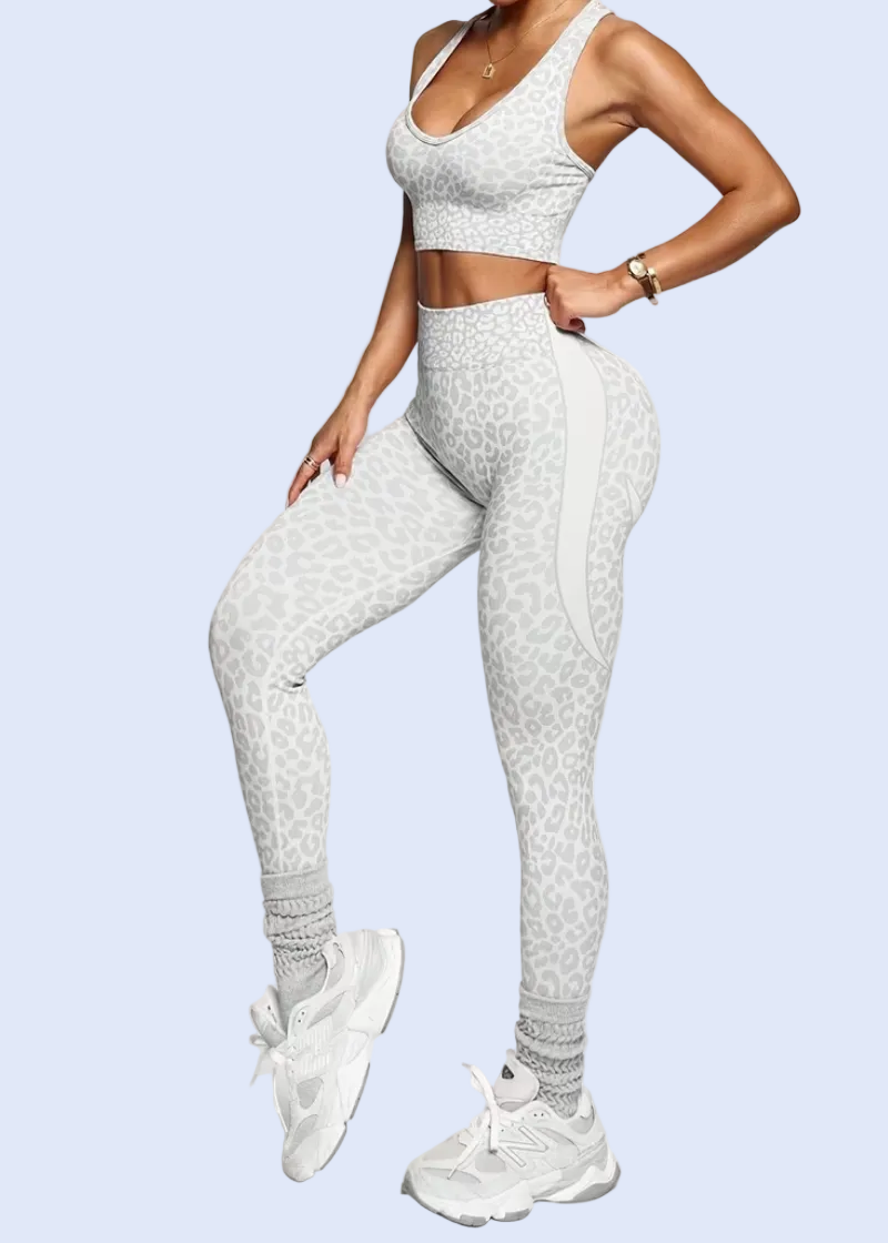 Person wearing a white athletic outfit on a plain background