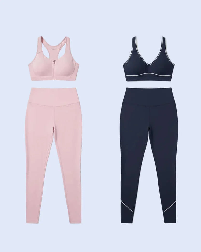 Pink and black sports bra and leggings set on a light purple background