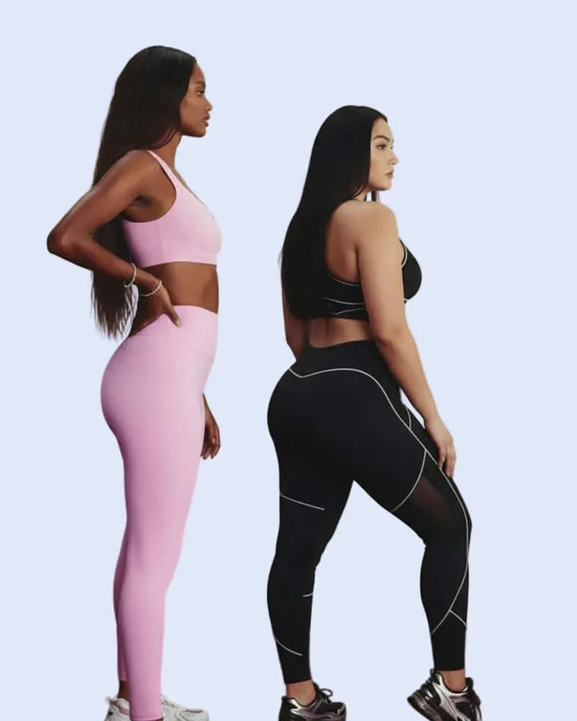 Two women wearing pink and black athletic outfits on a light gray background