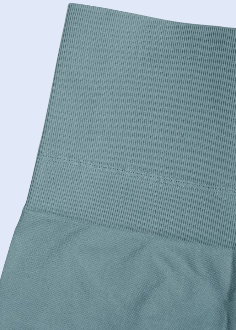 Teal fabric on a white background with a cart icon at the bottom right corner.