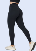 Person wearing black leggings on a white background