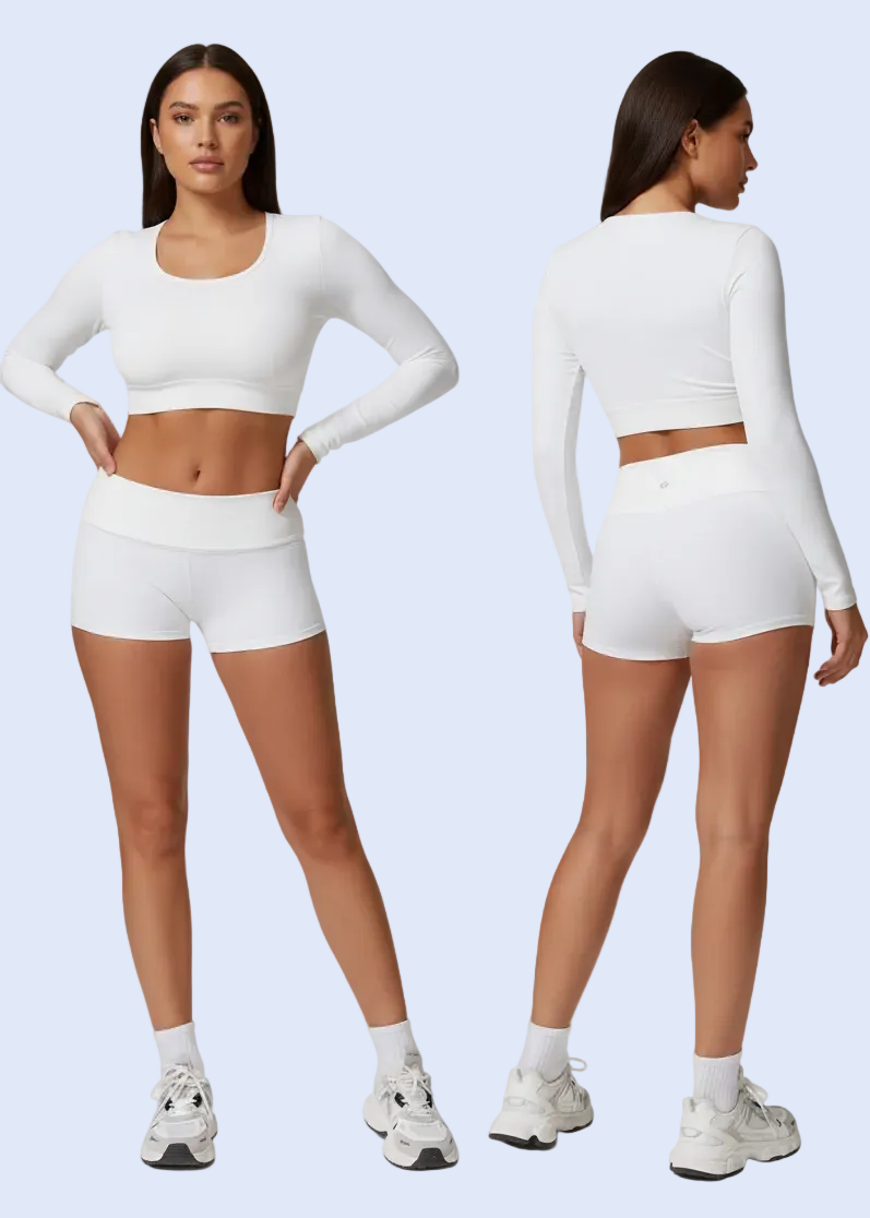 Person wearing a white long-sleeve top and shorts on a gray background