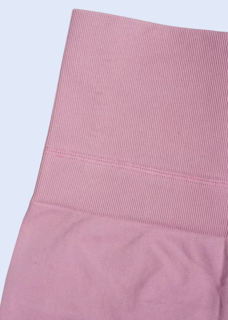 Folded pink fabric on a white background
