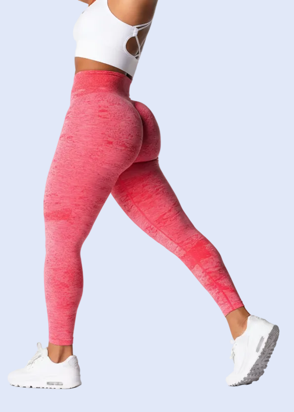 Person wearing pink leggings on a white background with product details.