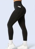 Woman in black high-waisted gym leggings with side pocket, affordable activewear from GymDeity