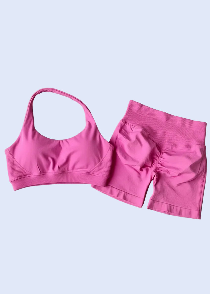 Pink bikini set on a gray background