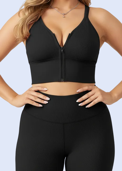 Black bra worn by a person on a plain background