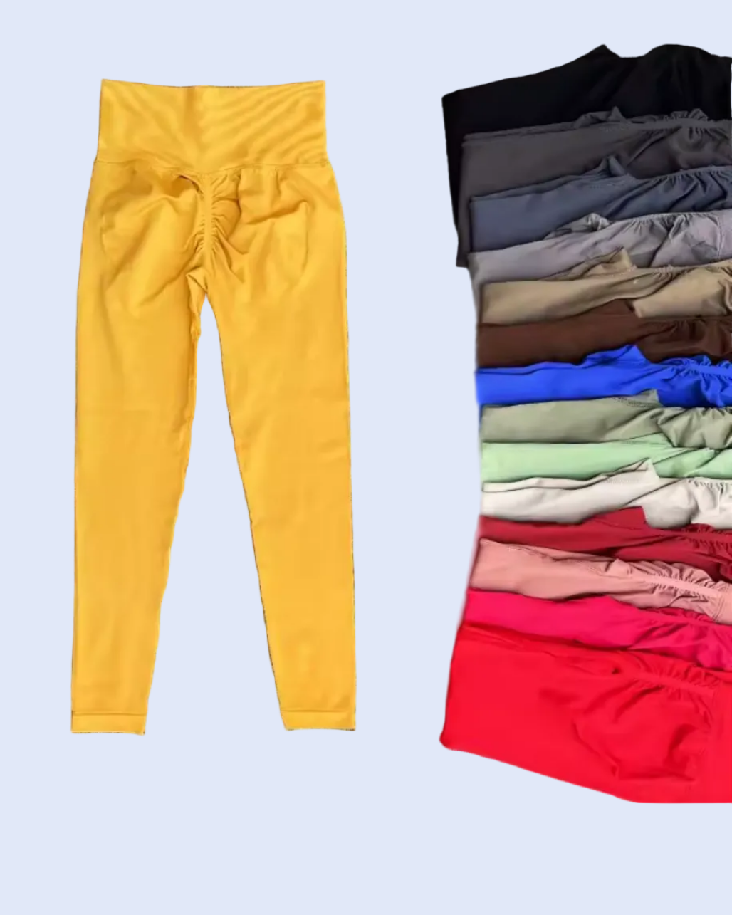 Yellow pants on a 
 WHITE surface with folded clothes in the background