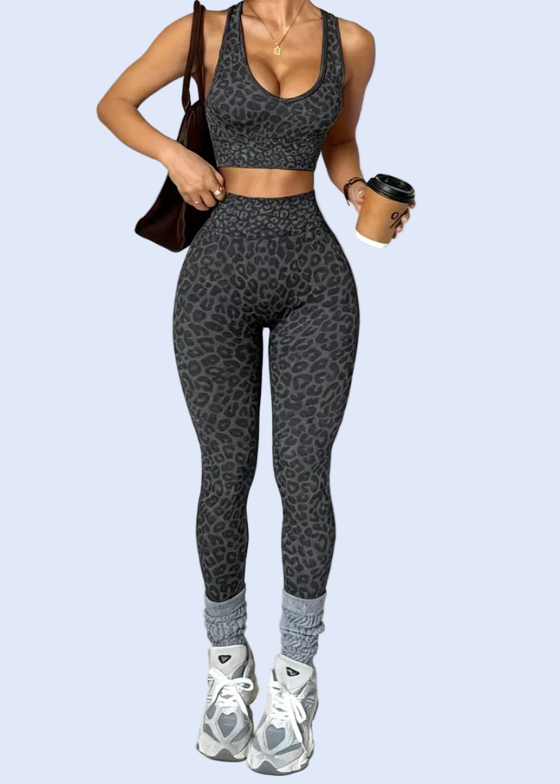 Person wearing a gray athletic outfit on a white background