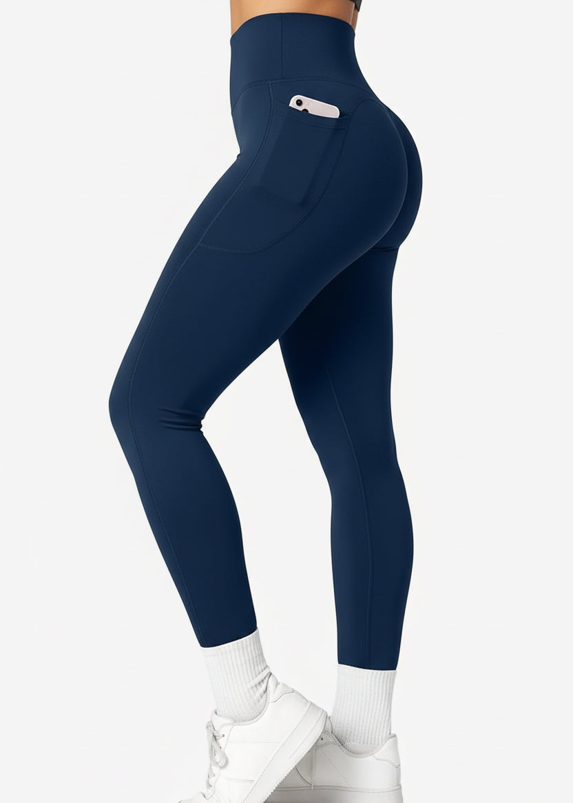 Woman wearing navy high-waisted gym leggings with side pocket, trendy activewear from GymDeity
