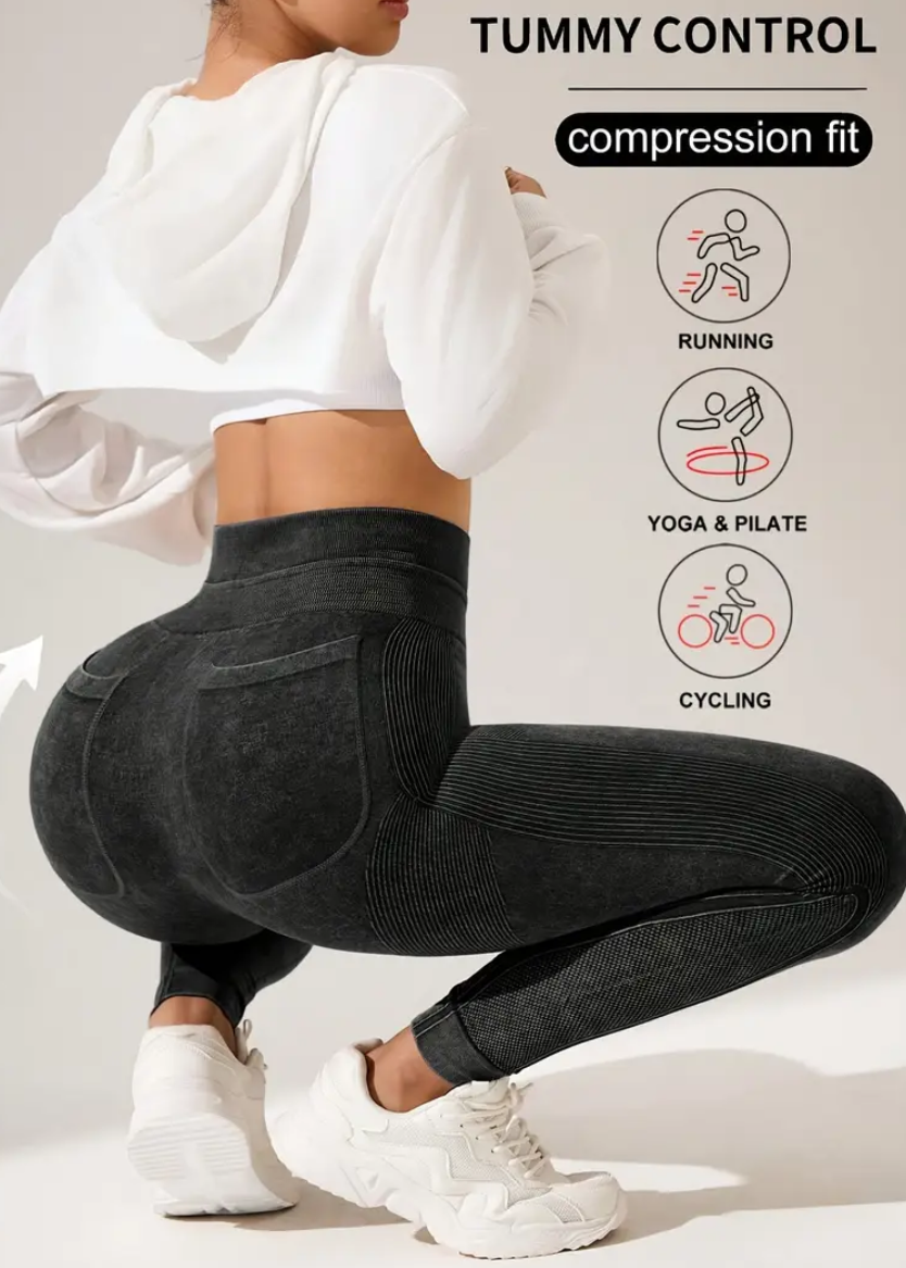 Person wearing black leggings with a graphic of 'Tummy Control' on a white background