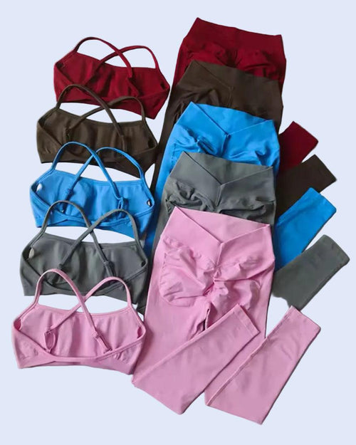 Collection of colorful bras and leggings on a gray background