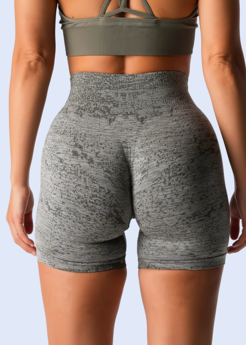 Gray athletic shorts being worn on a person, with an option to add to cart or buy now.