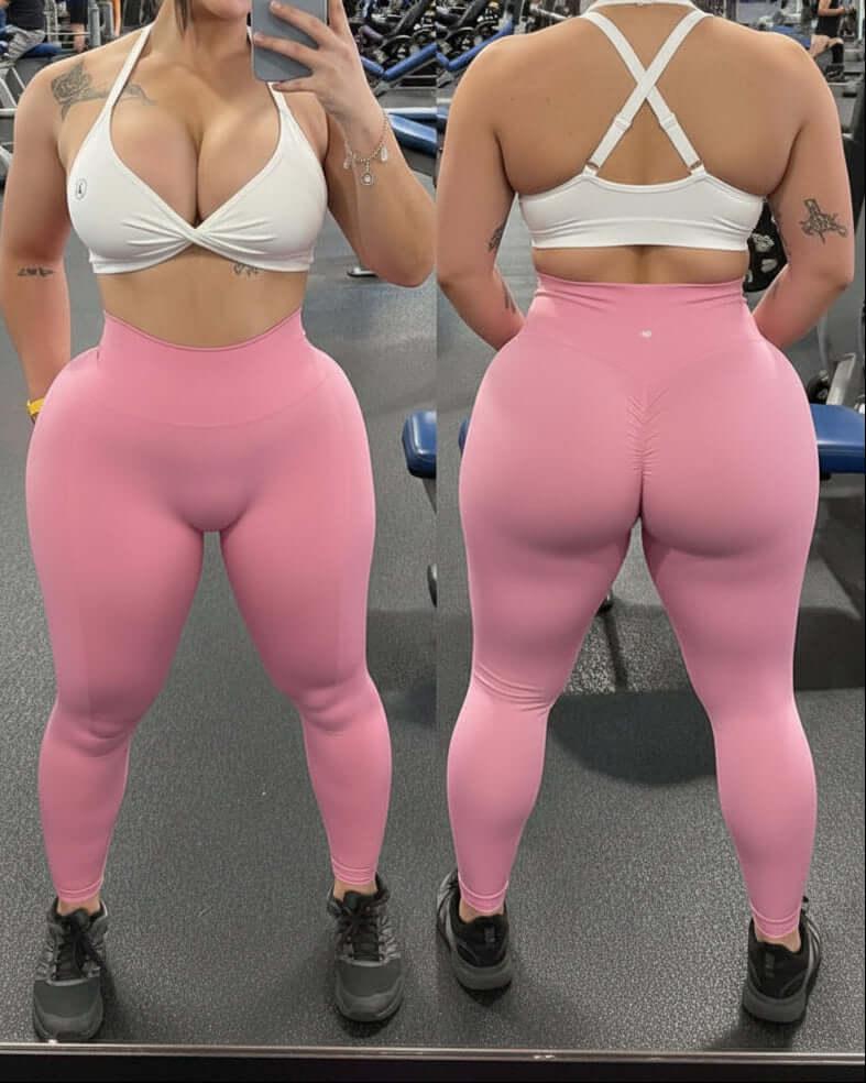 Person wearing a white sports bra and pink leggings in a gym setting.