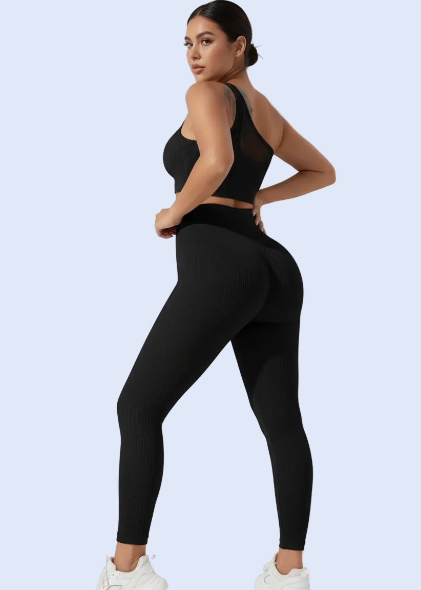 Person wearing a black outfit with a white background