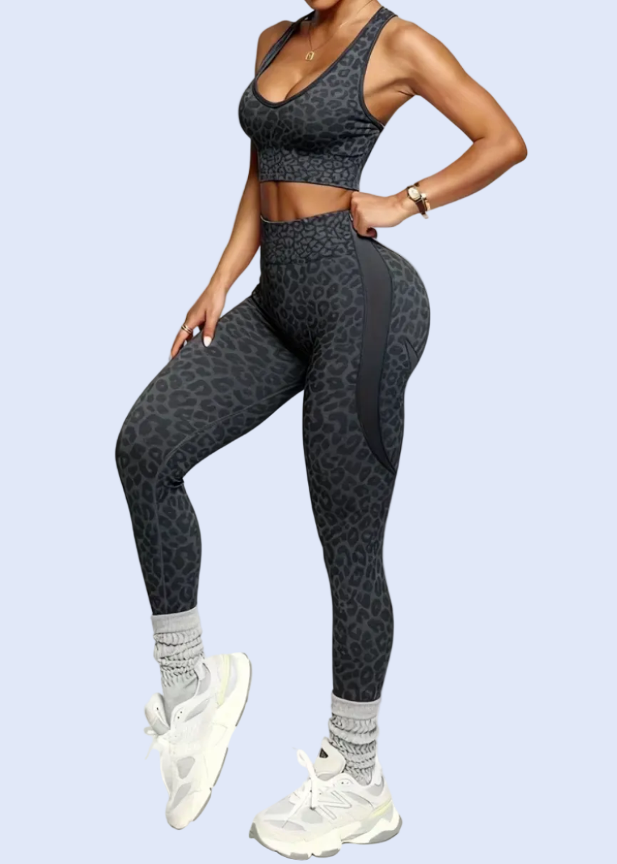 Person wearing a black athletic outfit on a white background