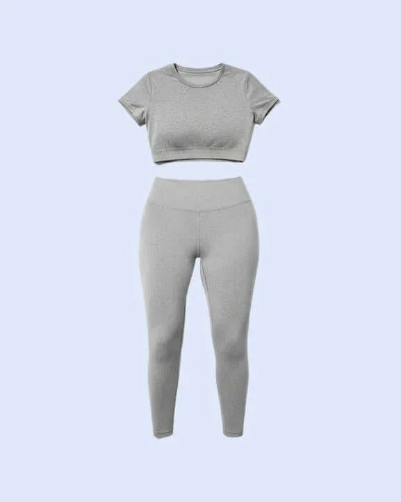 Woman wearing a gray athletic outfit from front and back views on a light blue background