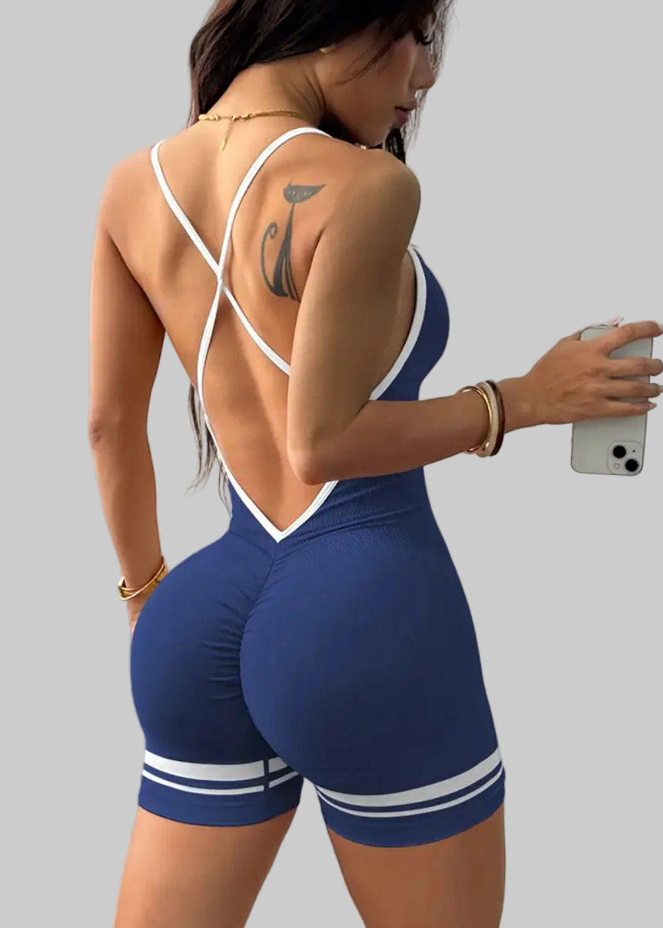 Woman wearing a blue and white sports outfit taking a selfie.