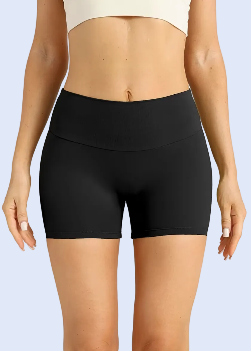 Black high-waisted shorts worn by a model on a plain background