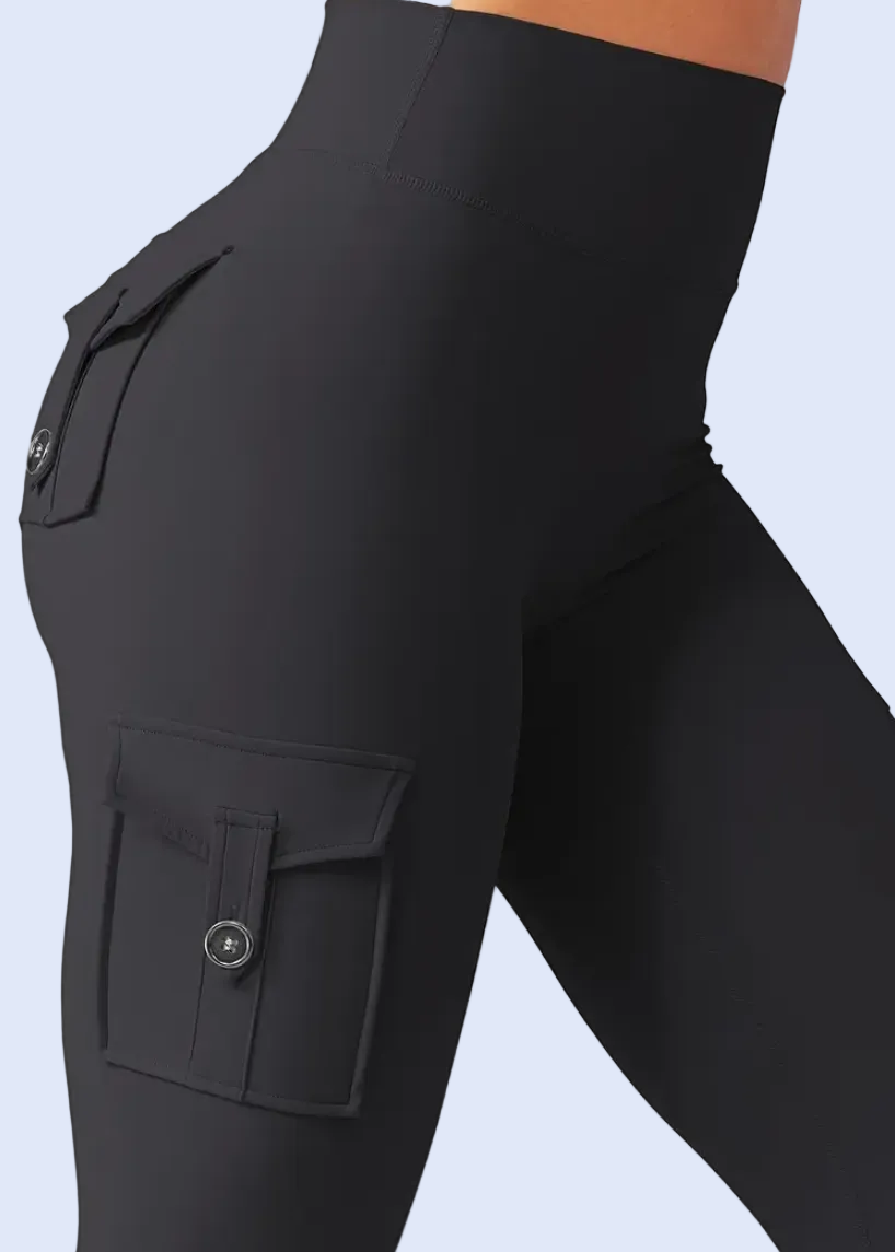 Black cargo pants on a person against a white background