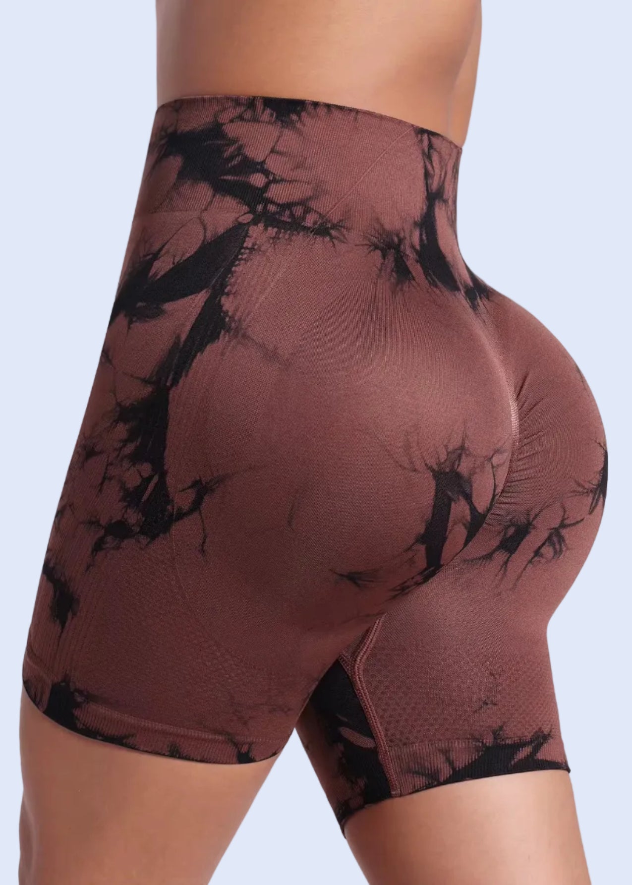 Brown and black patterned shorts on a white background