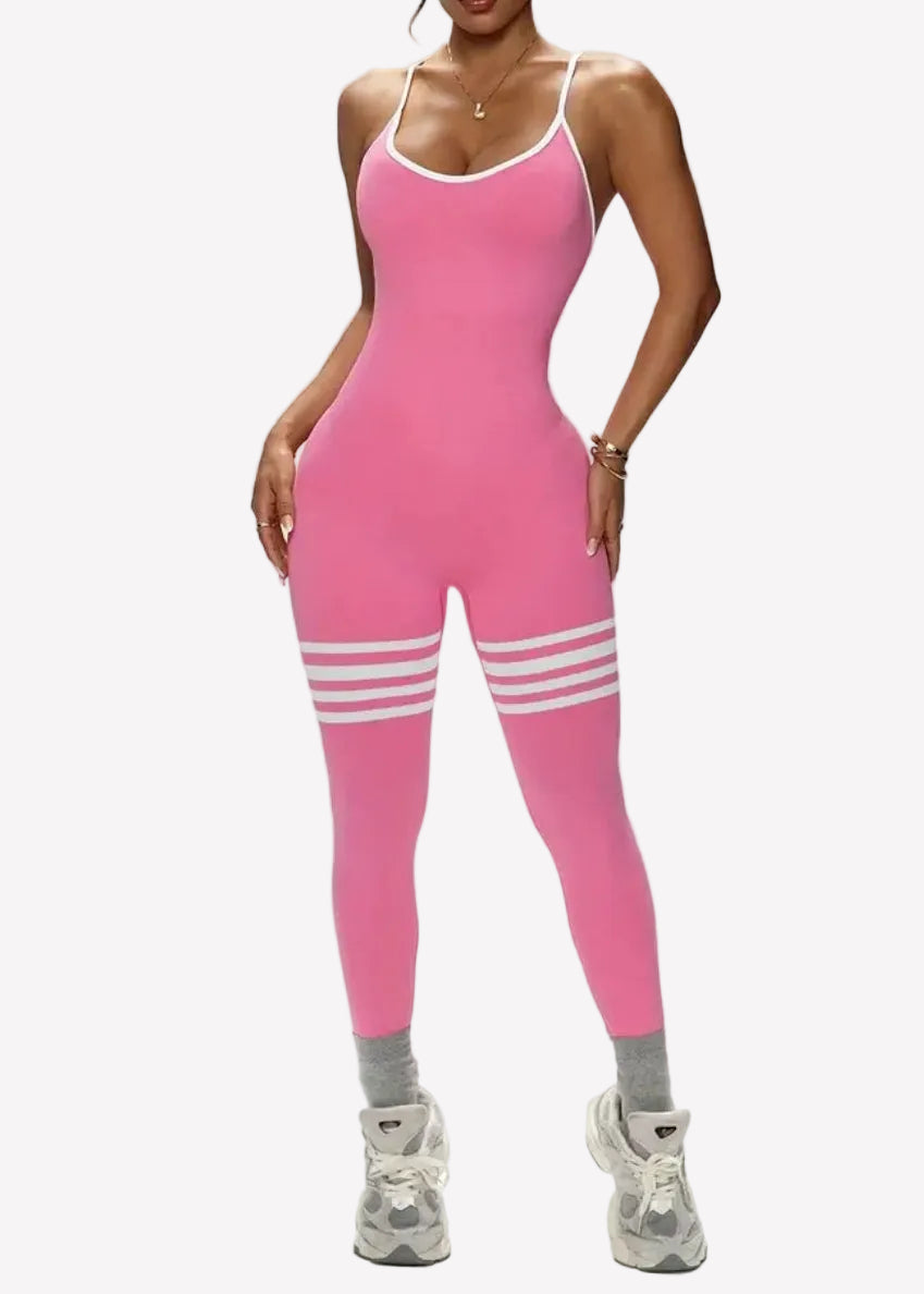 Person wearing a pink bodysuit with white stripes on a gray background