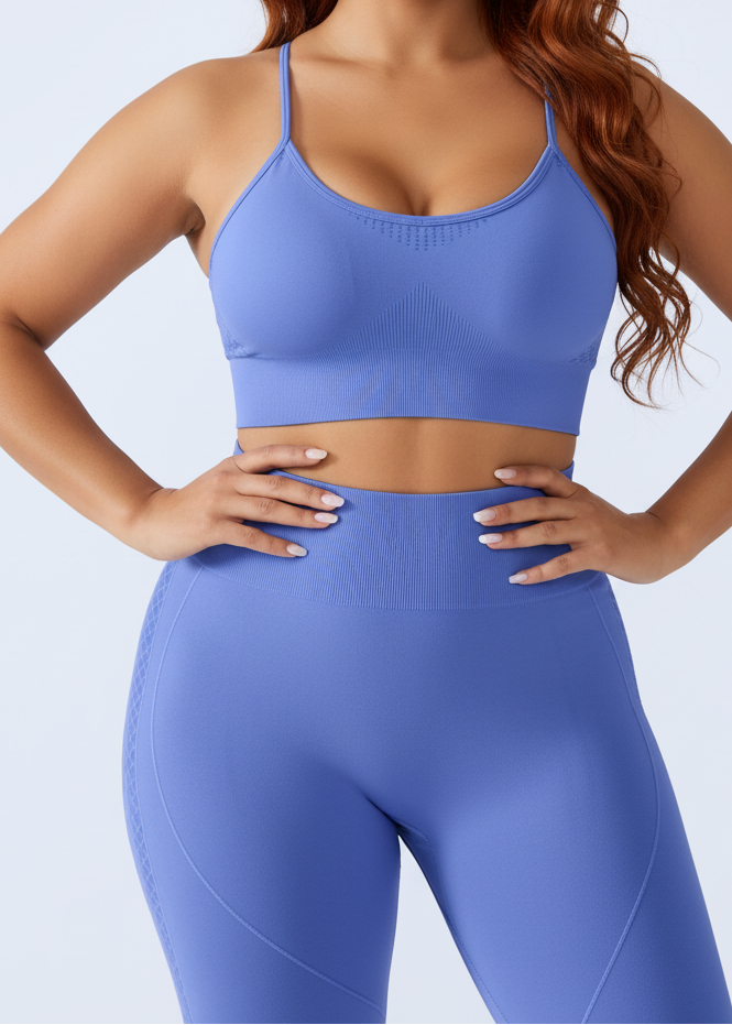 Person wearing a blue sports bra and leggings on a light gray background