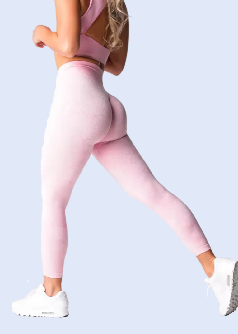 Woman wearing baby pink leggings on a white background with product details at the bottom.