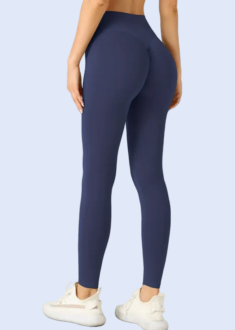 Person wearing blue leggings on a white background