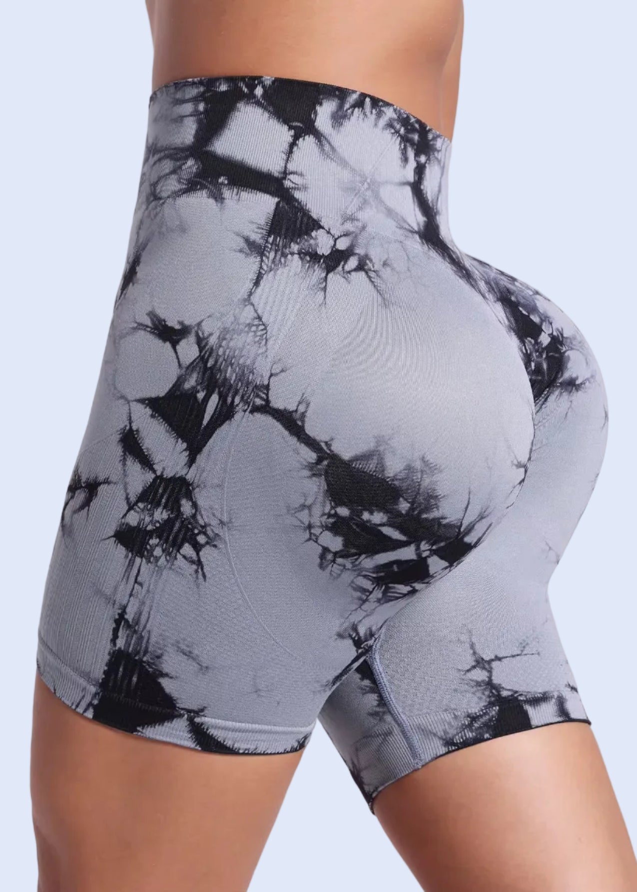 Gray and black tie-dye athletic shorts on a white background