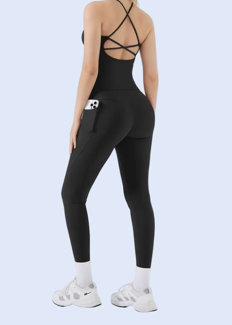 Person wearing a black athletic outfit on a white background