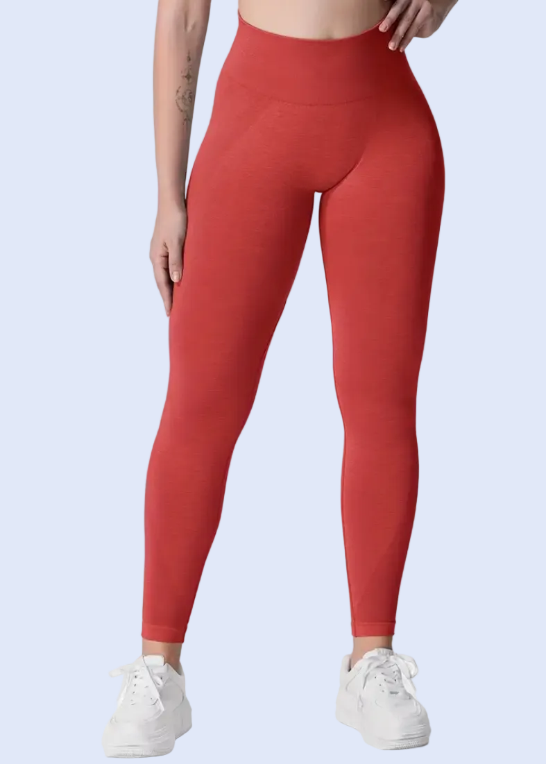 Person wearing red leggings on a white background