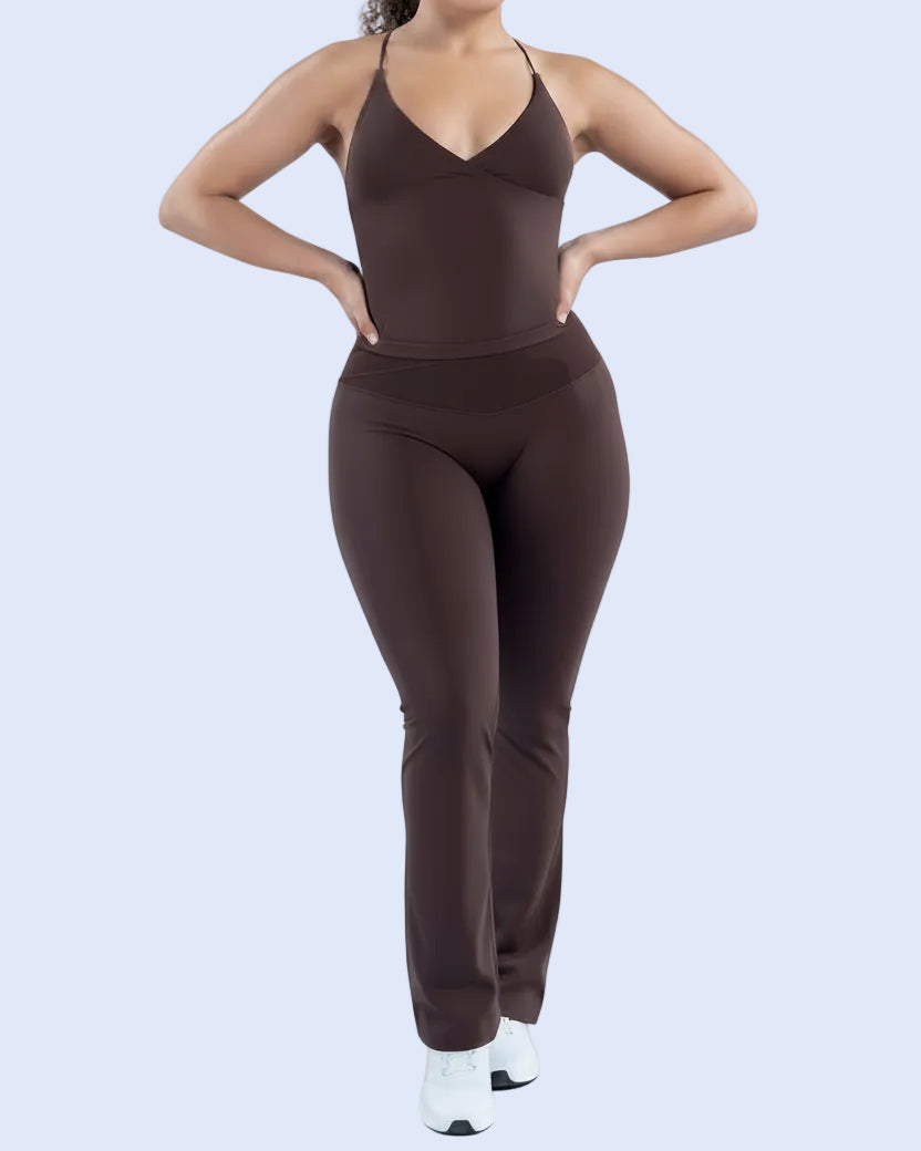 Brown athletic outfit worn by a person on a light blue background