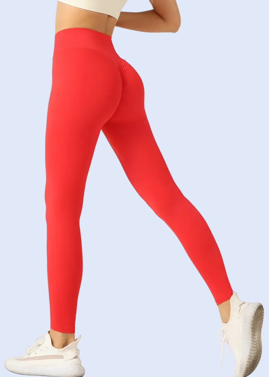 Red leggings worn by a person on a white background