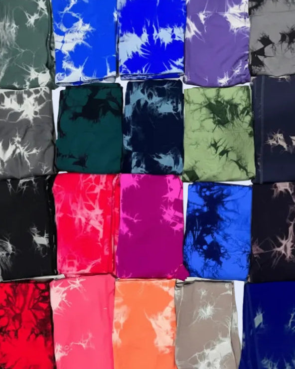Collection of tie-dye fabric leggings with scrunch in various colors.