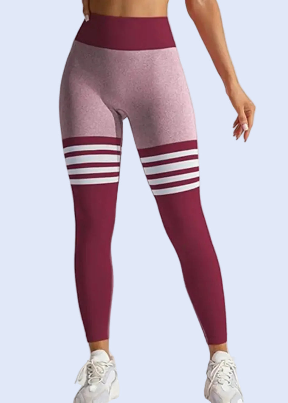 Maroon and pink leggings with white stripes on a light gray background