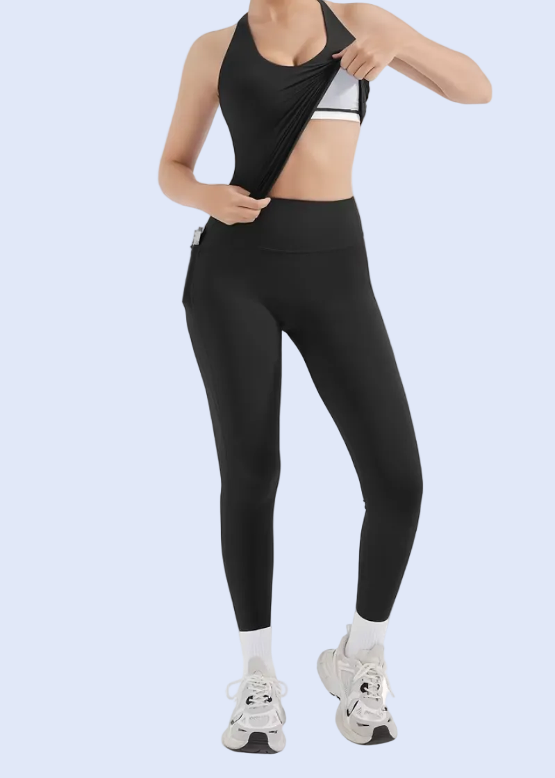 Person wearing a black athletic outfit on a white background
