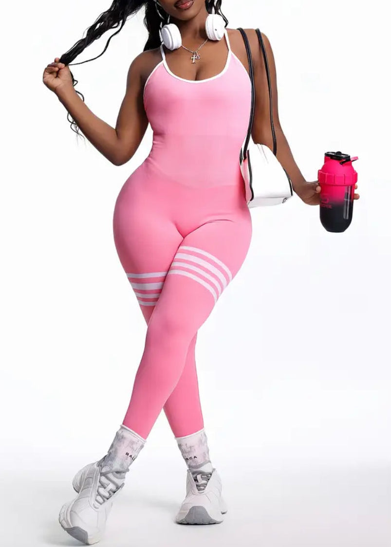 Person wearing a pink outfit with white accessories on a white background