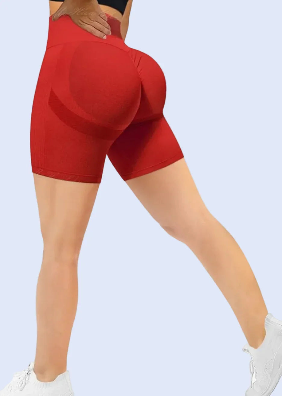 Red shorts being modeled on a white background with Amazon.com URL at the top.