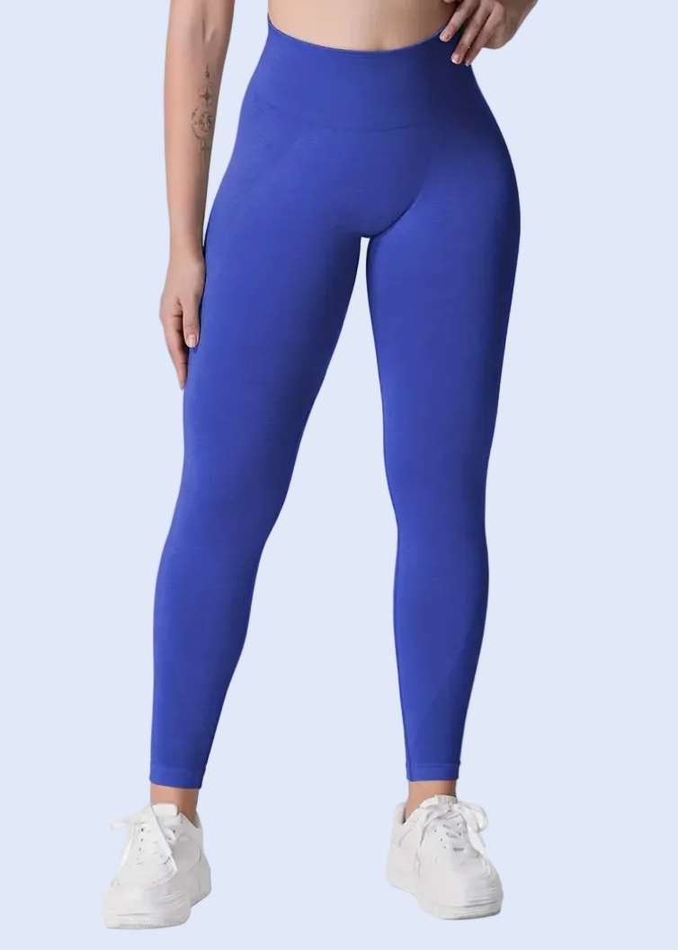 Person wearing blue leggings on a white background