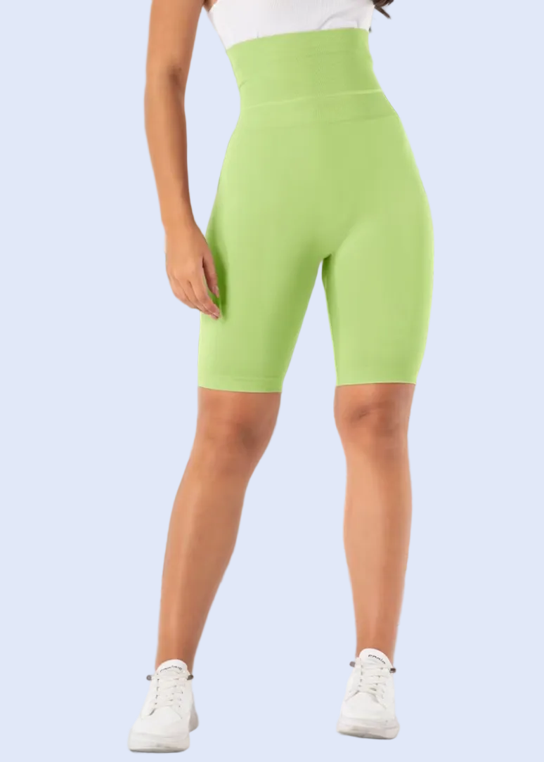 Person wearing bright green shorts in a kitchen setting