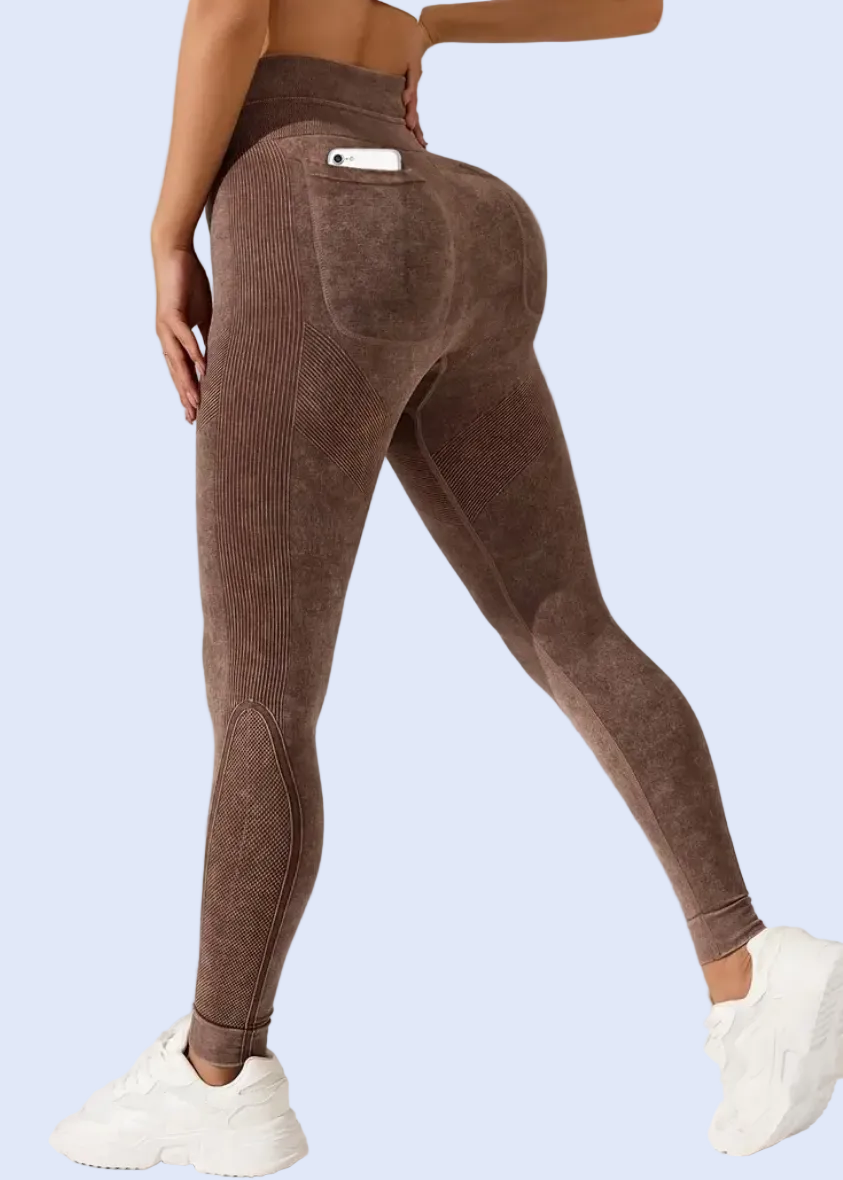 Brown leggings worn by a person on a white background