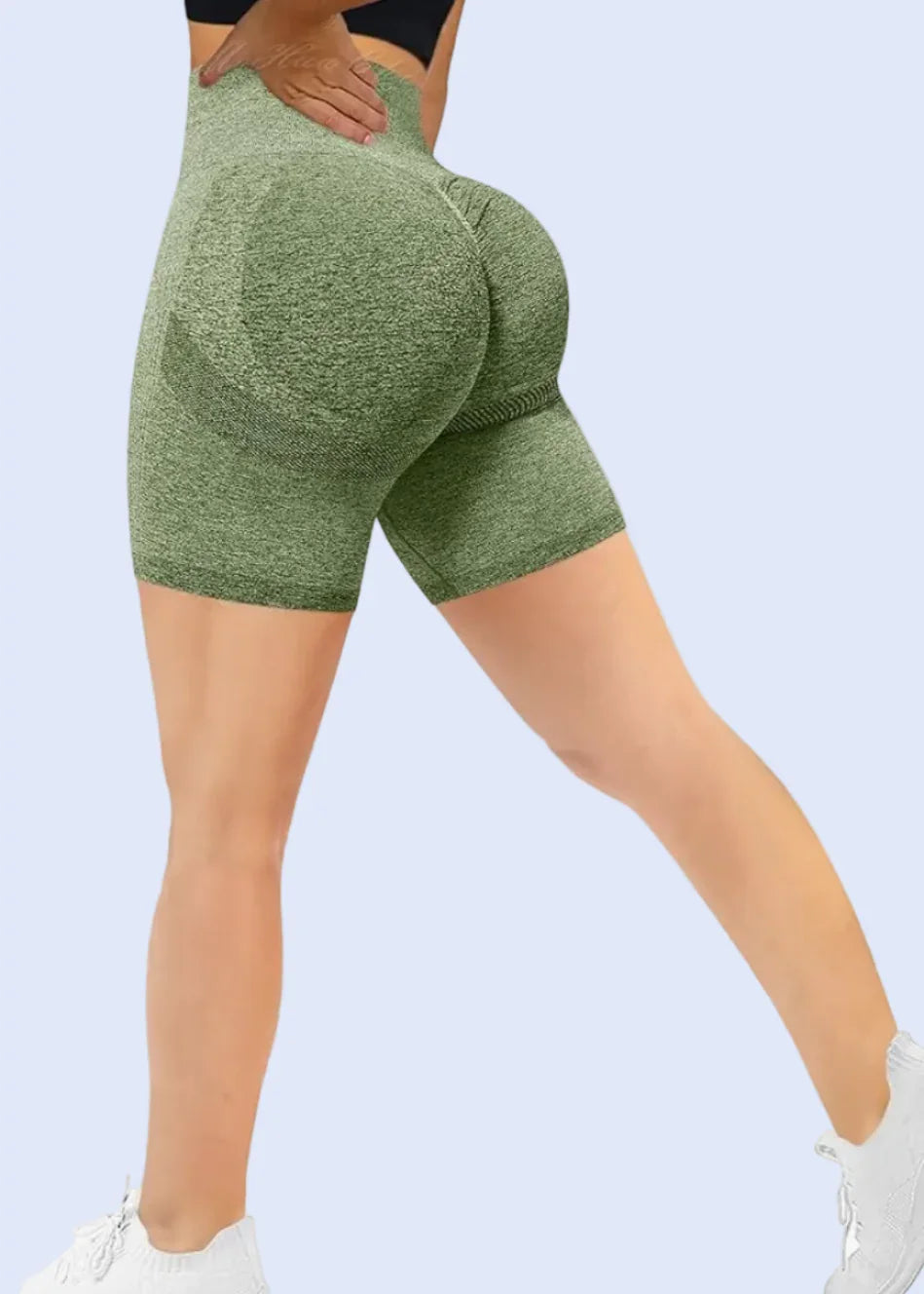 Green gym leggings being worn on a white background with Amazon.com displayed at the top.