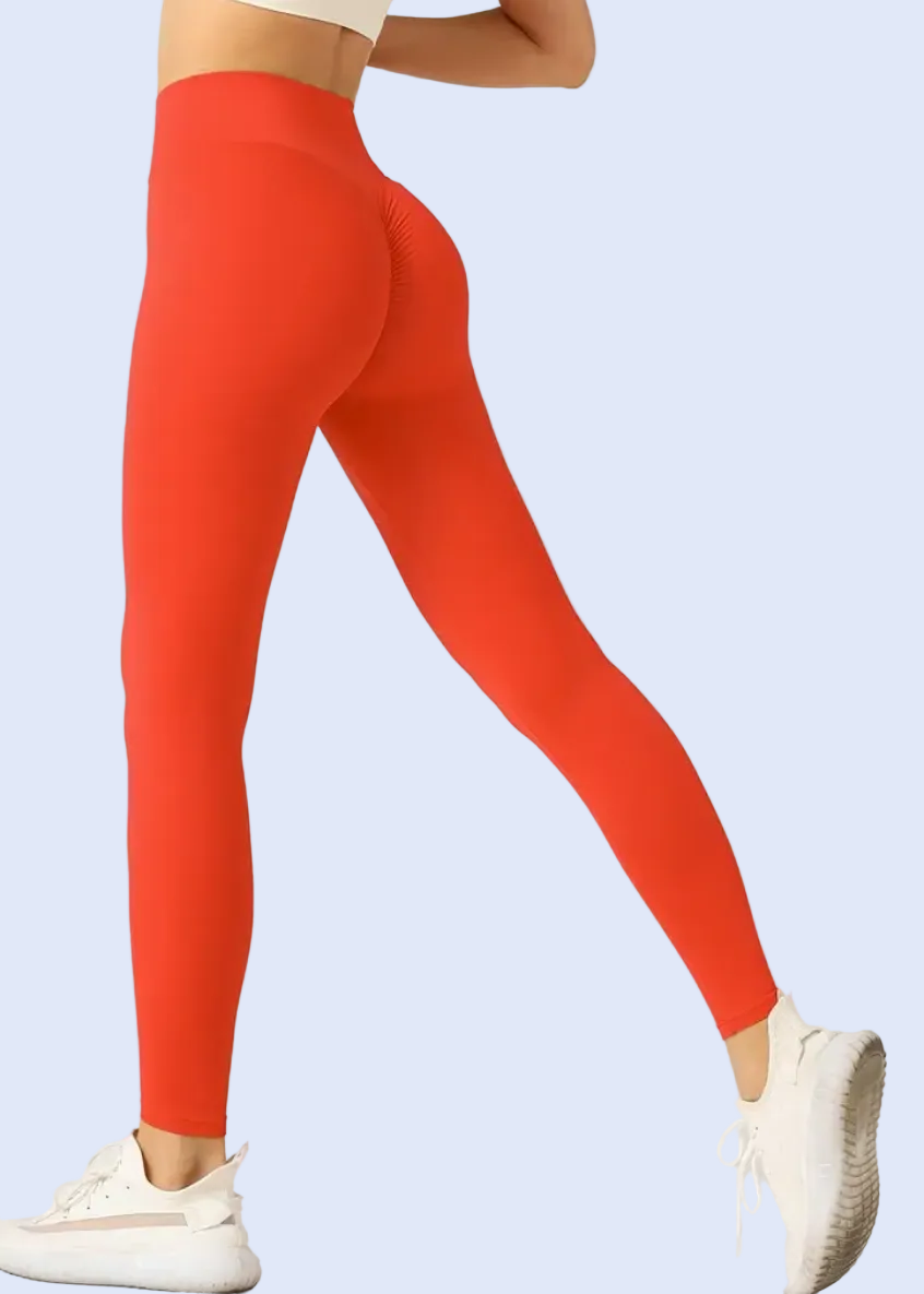 Red leggings worn by a person on a white background