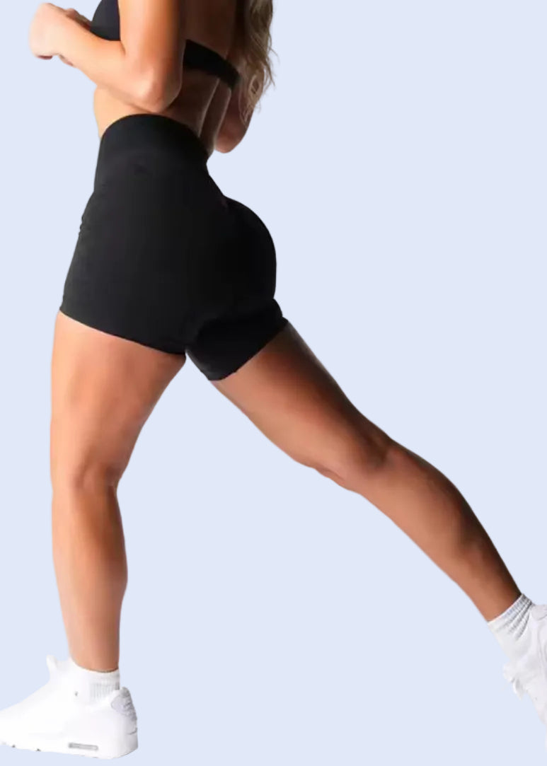 Person wearing black leggings on a white background