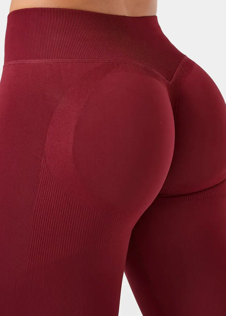 Maroon leggings with a focus on the waistband and leg area.